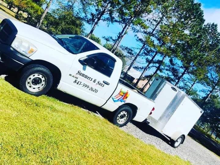 Summers and Sons Jump Castles branded truck and delivery trailer